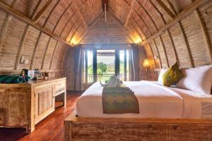 Voodi või voodid majutusasutuse AlamGangga Villas Tirta Gangga toas