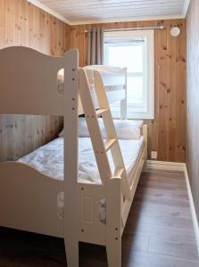 a bunk bed room with two bunk beds in a cabin at Lastølen 2 bedrooms in Sykkylven