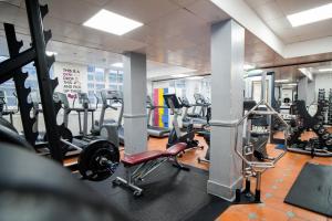 a gym with lots of treadmills and weights at Bowden Court (Notting Hill) in London
