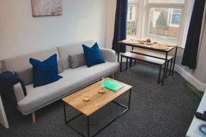 a living room with a couch and a table at Cosy 2 Bedroom Flat in Sunderland in Sunderland