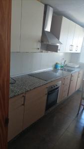 Kuchyň nebo kuchyňský kout v ubytování Apartamento Jean Pool