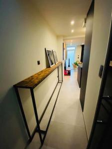 a hallway with a counter in a room at Superbe appartement chic et design in Seraing +16 photos