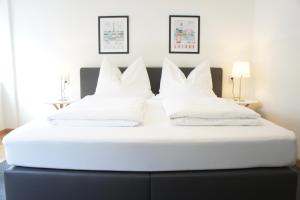 Posteľ alebo postele v izbe v ubytovaní Schwarzacherhof Pension & Apartments