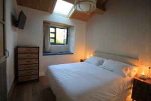 Postel nebo postele na pokoji v ubytování Casas da Fortaleza