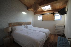 Postel nebo postele na pokoji v ubytování Casas da Fortaleza
