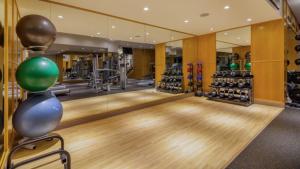 a fitness room with a mirror and a gym at UWS 1BR w Gym Doorman nr Julliard NYC-832 in New York
