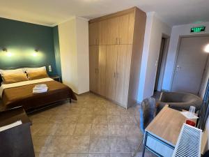 A bed or beds in a room at Queen of Orliaka
