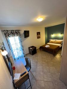 A bed or beds in a room at Queen of Orliaka