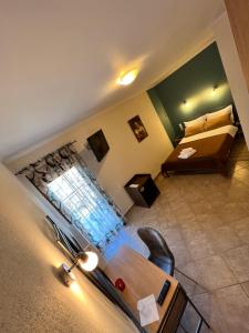 A bed or beds in a room at Queen of Orliaka