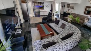 a living room with a couch and a table at Lamia - Premium apartment in Lamía