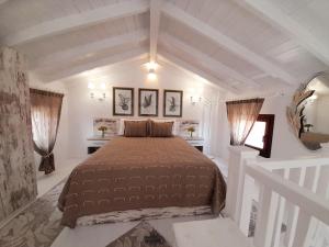 a bedroom with a large bed in a white room at AGORA LUXURY LOFT in Agios Nikolaos +56 photos