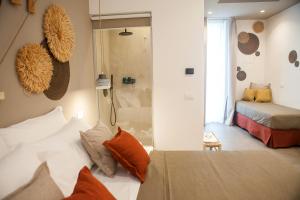 Postel nebo postele na pokoji v ubytování NEREA - Apulian Suite and Rooms