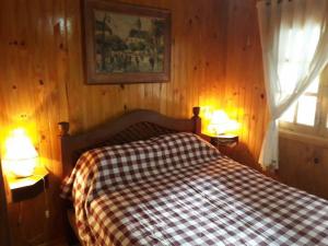 Llit o llits en una habitació de Cabaña Familiar El Refugio