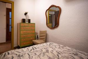 A bed or beds in a room at AT055 Planta baja en el paseo marítimo con vistas a la playa