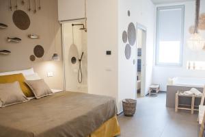 Postel nebo postele na pokoji v ubytování NEREA - Apulian Suite and Rooms