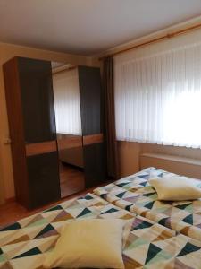 a bedroom with a bed and a window at Ferienwohnung Katharina in Bernkastel-Kues