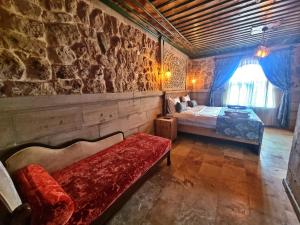 Postel nebo postele na pokoji v ubytování Muskara Cave Hotel