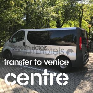 a white van parked in a parking lot with the words transfer to vehicle centre at Antony Palace Hotel - Venice Airport in Marcon