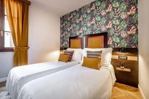 Postel nebo postele na pokoji v ubytování Hotel Duomo Firenze