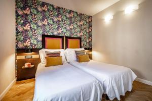 Postel nebo postele na pokoji v ubytování Hotel Duomo Firenze