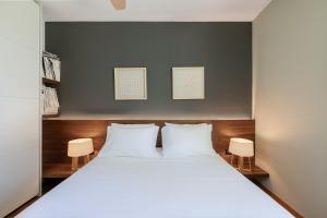 a bedroom with a large bed with two white pillows at Villa 7 in Perivólia