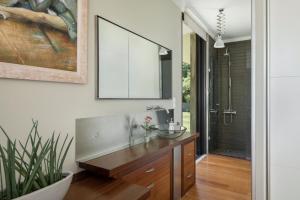a bathroom with a sink and a mirror at Villa 7 in Perivólia