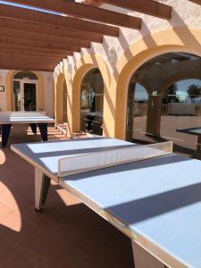 a couple of ping pong tables in a building at Pool paradise in Calpe