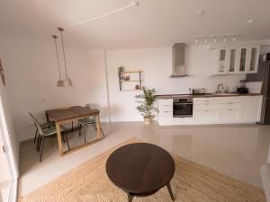 a kitchen with a table and a dining room at Casa Arjuna in Valle Gran Rey