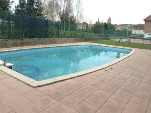 a swimming pool with blue water in a yard at Cabo Quintres - 12012 in Ajo