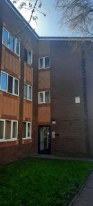 a brick building with a door in the side of it at Sublime Jadwin, Liverpool Lime City in Liverpool