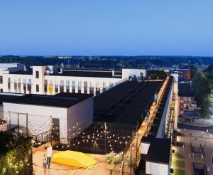 a view of a building with a yellow umbrella at Radio City loft - apartment 420 in Kaunas