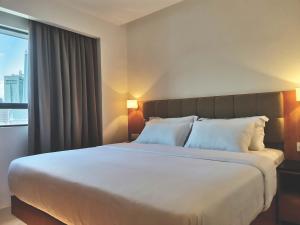 Postel nebo postele na pokoji v ubytování D Loft Hotel