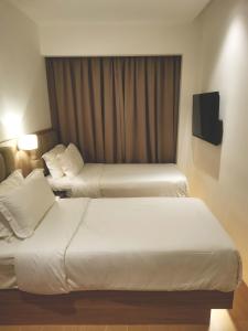 Postel nebo postele na pokoji v ubytování D Loft Hotel