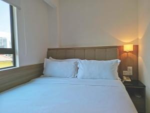 Postel nebo postele na pokoji v ubytování D Loft Hotel