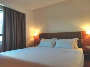 Postel nebo postele na pokoji v ubytování D Loft Hotel