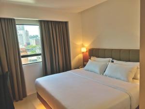 Postel nebo postele na pokoji v ubytování D Loft Hotel