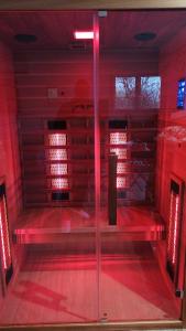 an empty room with red lights on the floor at Loft sauna jacuzzi ospariegeois in Lavelanet