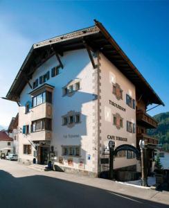 a large white building with a sign on it at Tirolerhof - Super Sommer Card included in Serfaus