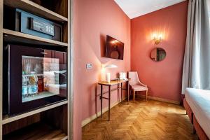 Postel nebo postele na pokoji v ubytování Hotel Duomo Firenze
