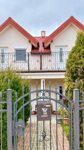 a house with a gate in front of it at Villa Gravaldi in Rowy