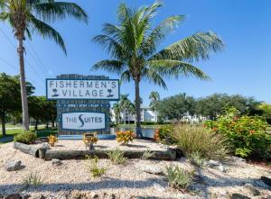 a sign for the entrance to the jesens villas the suites at Waterfront Condo #7 in Punta Gorda