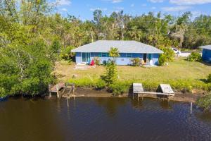 a house on the shore of a body of water at Waterfront Condo #6 in Punta Gorda