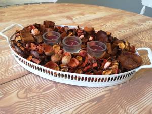 a container filled with different types of shells on a table at San Paolo Cottage 54 in Rome