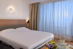 Postel nebo postele na pokoji v ubytování Residence Residéal Antibes