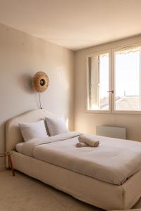 Posteľ alebo postele v izbe v ubytovaní CHARME ZEN Thermes 3 Étoiles