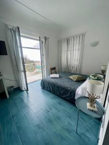 Postel nebo postele na pokoji v ubytování Casa OIKIA Anacapri