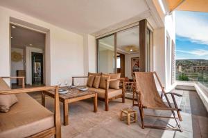 a living room with a couch and a table at Kube Taghazout - Luxe - 5Px in Taghazout +23 photos