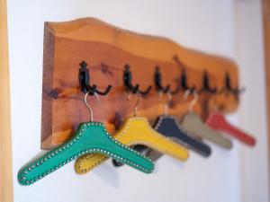 a wooden rack with starfish hooks on a wall at Apartment Muverans I L2 by Interhome in Nendaz
