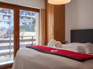Letto o letti in una camera di Apartment Olympic R4 by Interhome
