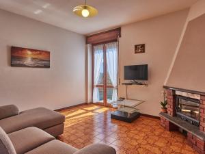 A television and/or entertainment centre at Holiday Home Simoni - GLA107 by Interhome